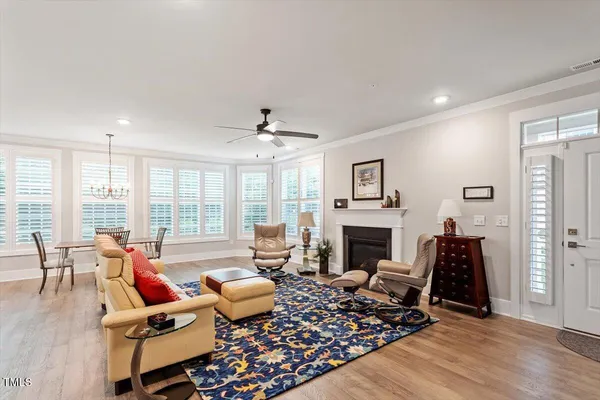 a living room with furniture fireplace and flat screen tv