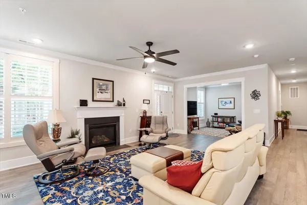 a living room with furniture fireplace and window