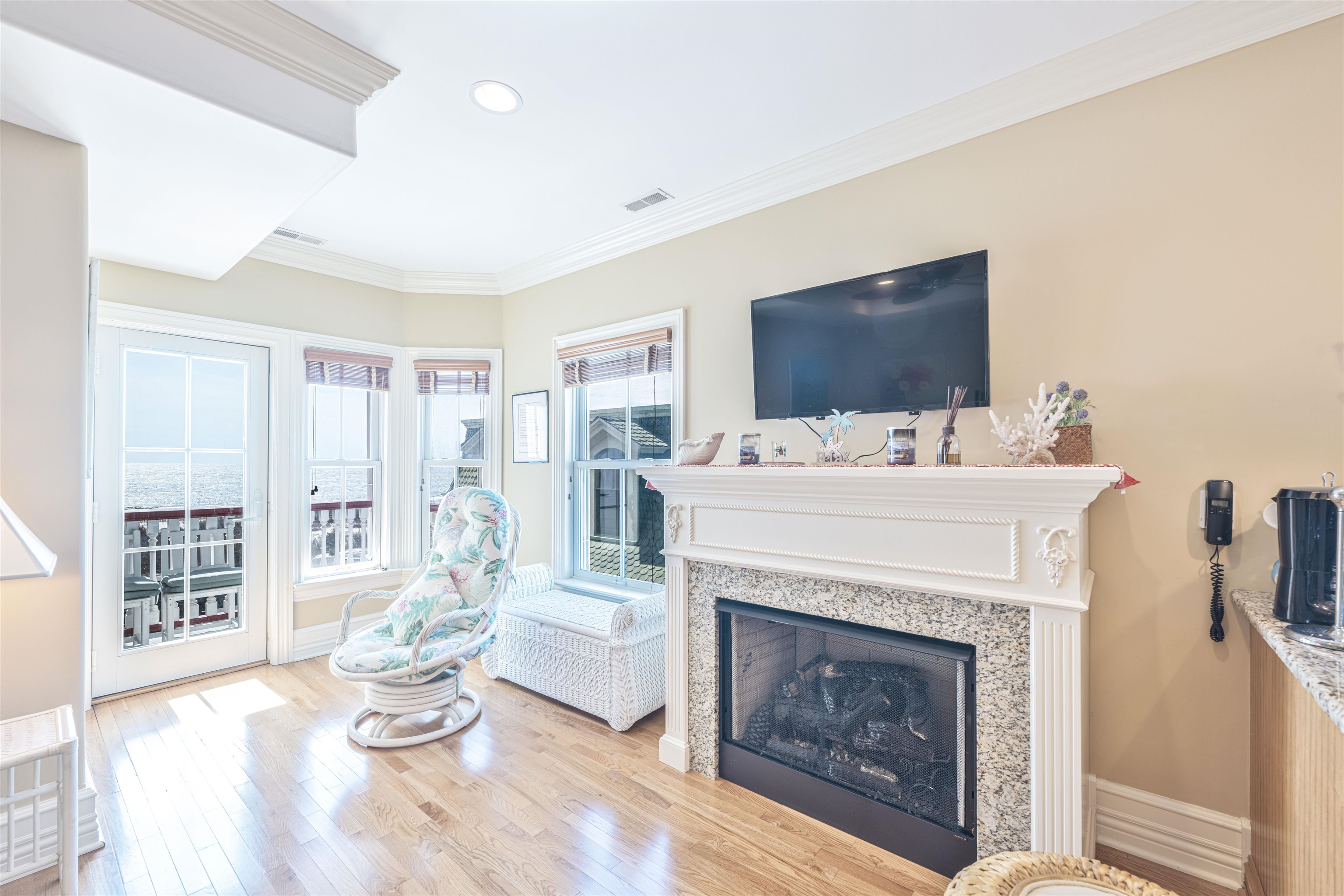 927 Beach, Unit 6 Cape May, NJ 08204 - Photo 12 of 34 a living room with furniture a fireplace and a flat screen tv
