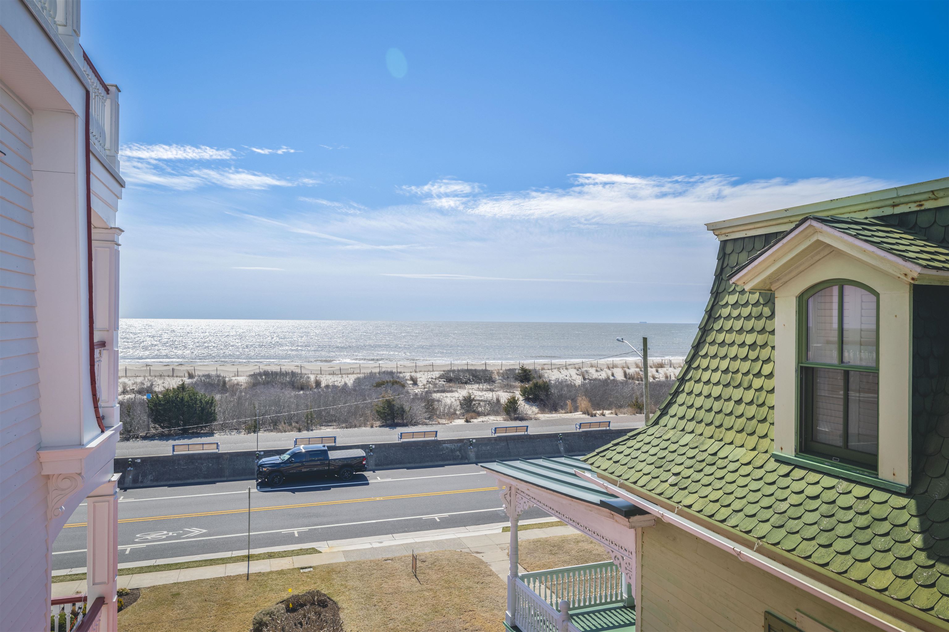 927 Beach, Unit 6 Cape May, NJ 08204 - Photo 15 of 34 a view of a balcony with floor to ceiling windows