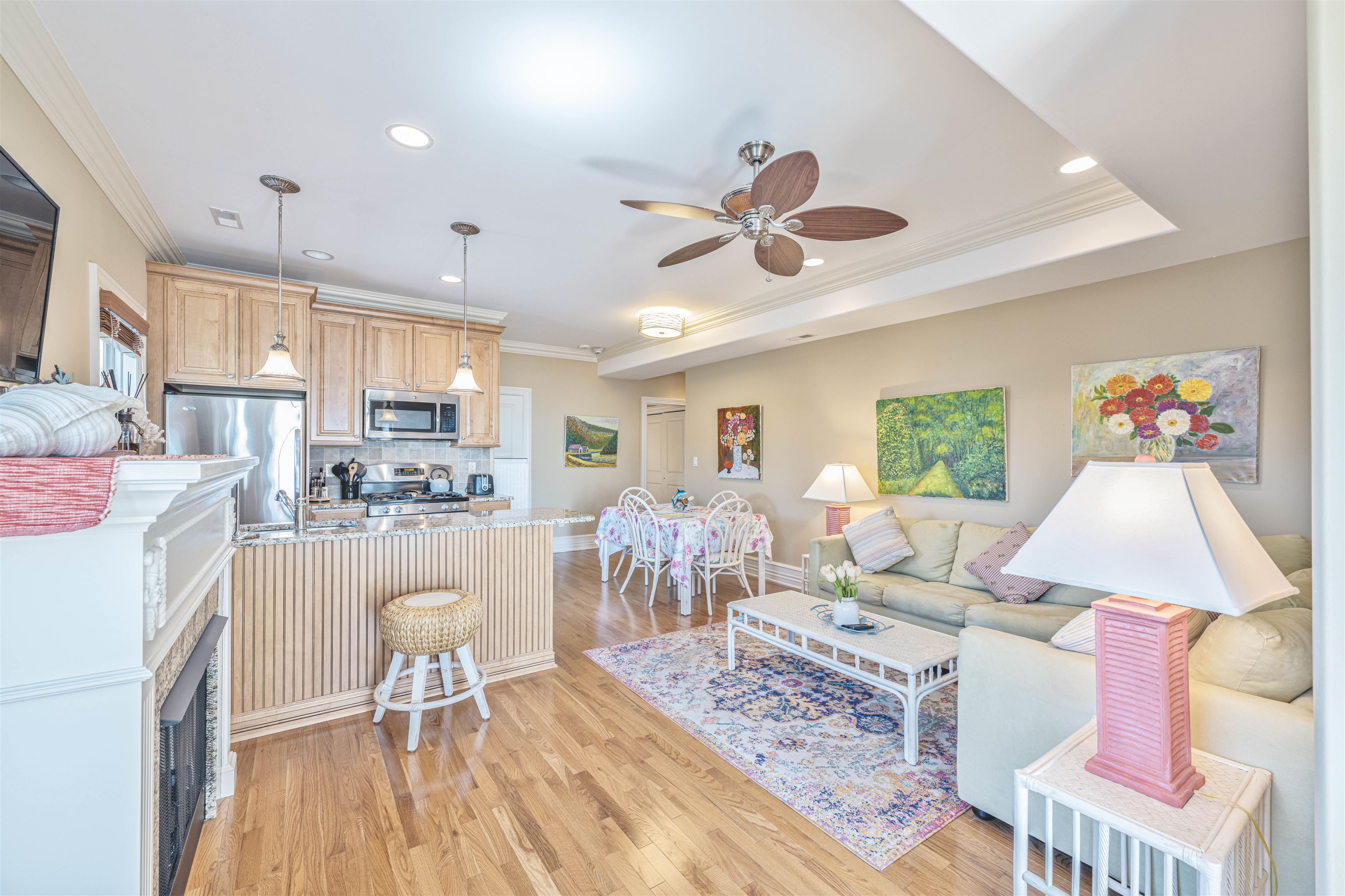 927 Beach, Unit 6 Cape May, NJ 08204 - Photo 17 of 34 a living room with dining table furniture and a wooden floor