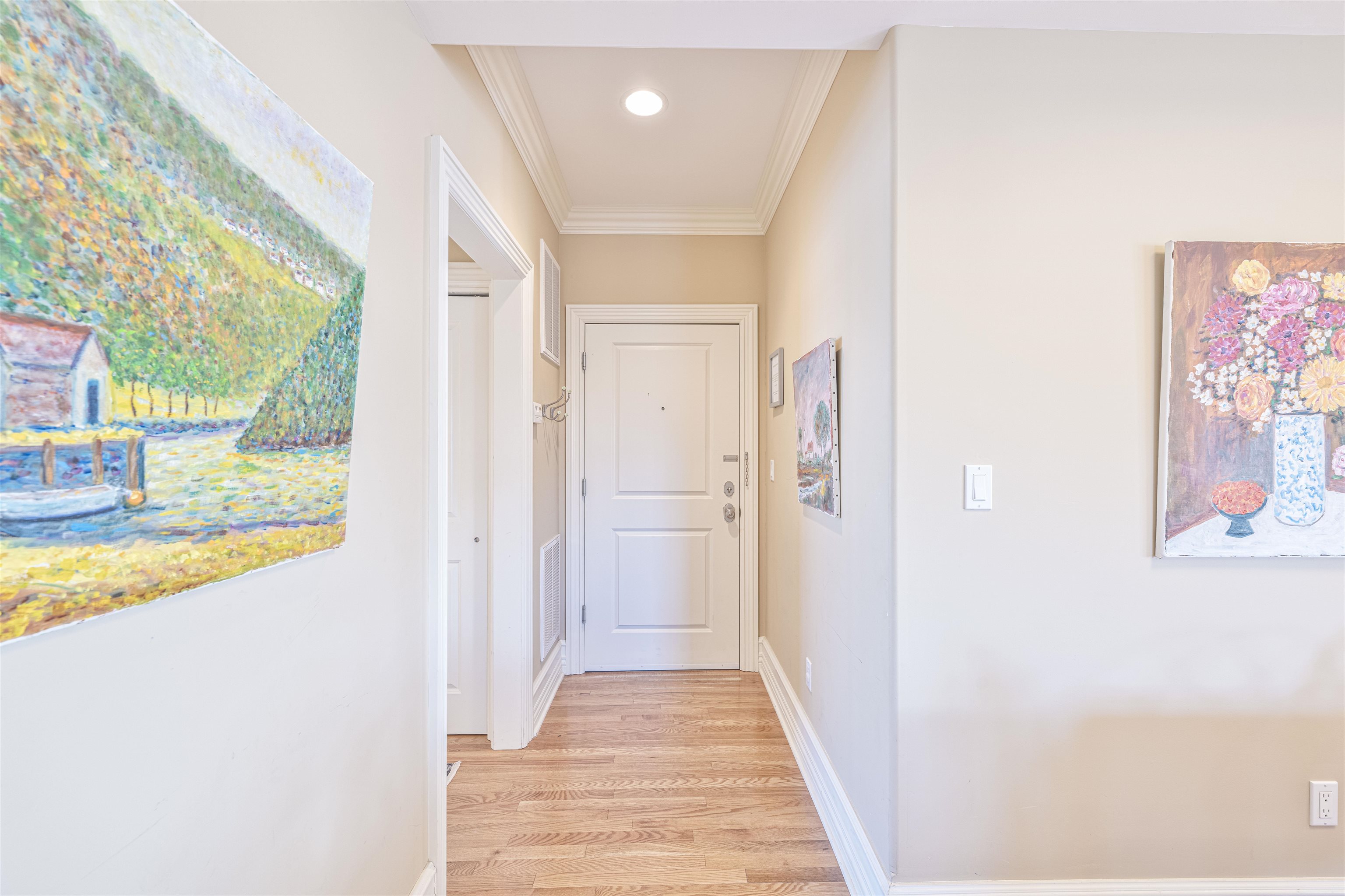 927 Beach, Unit 6 Cape May, NJ 08204 - Photo 2 of 34 a view of a hallway with wooden floor and a bathroom