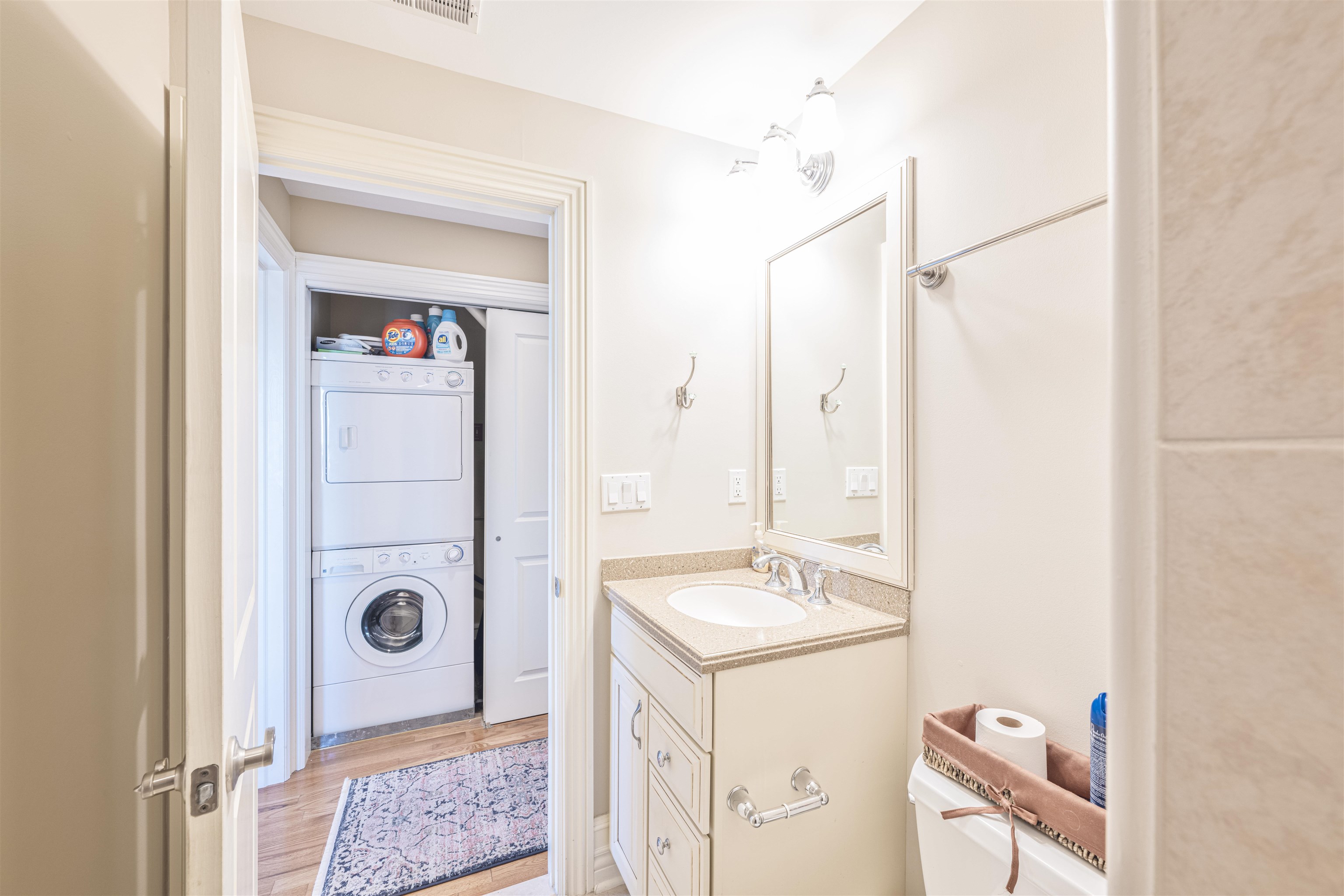 927 Beach, Unit 6 Cape May, NJ 08204 - Photo 21 of 34 a bathroom with a sink a mirror and a shower