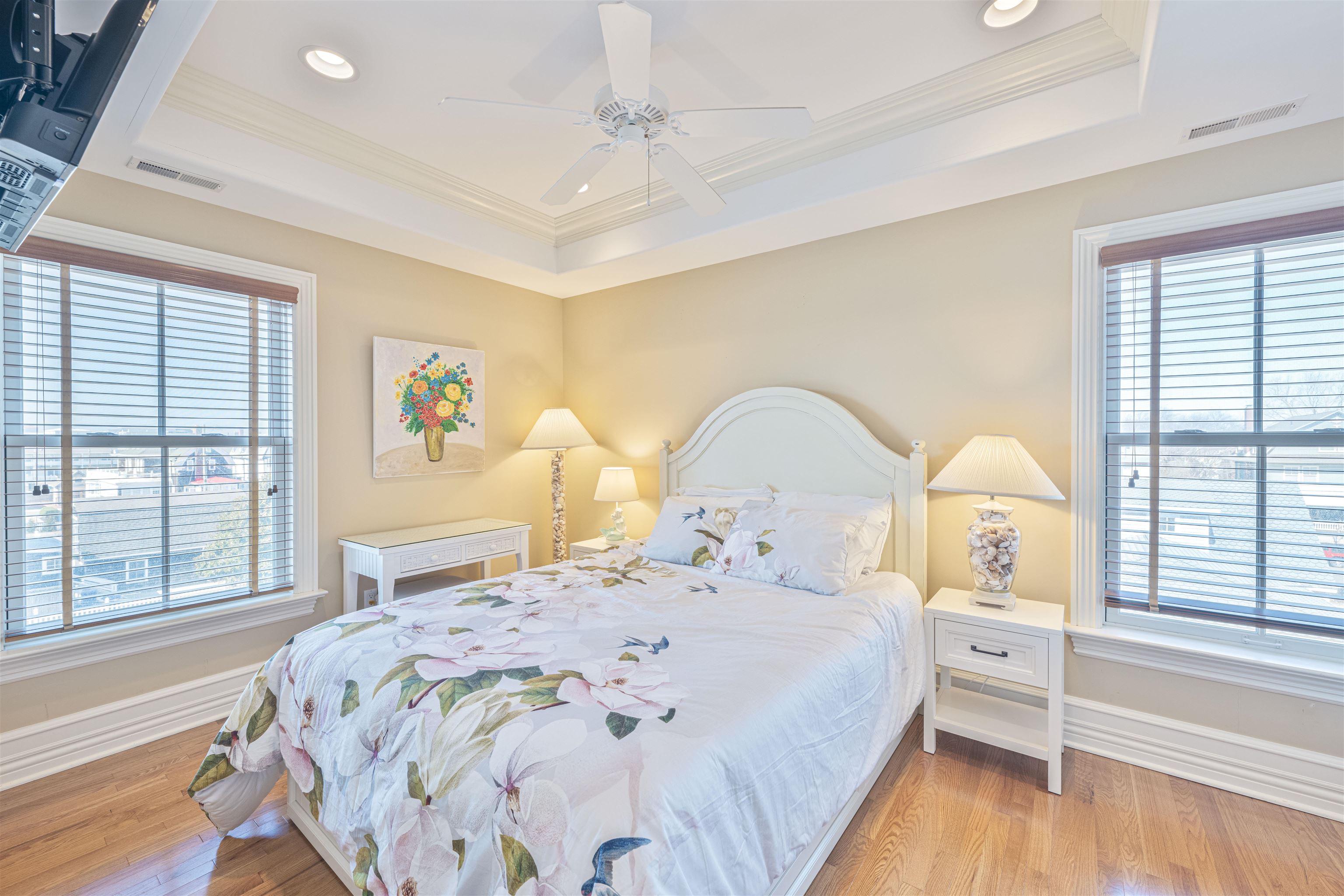 927 Beach, Unit 6 Cape May, NJ 08204 - Photo 22 of 34 a bedroom with a bed and a large window