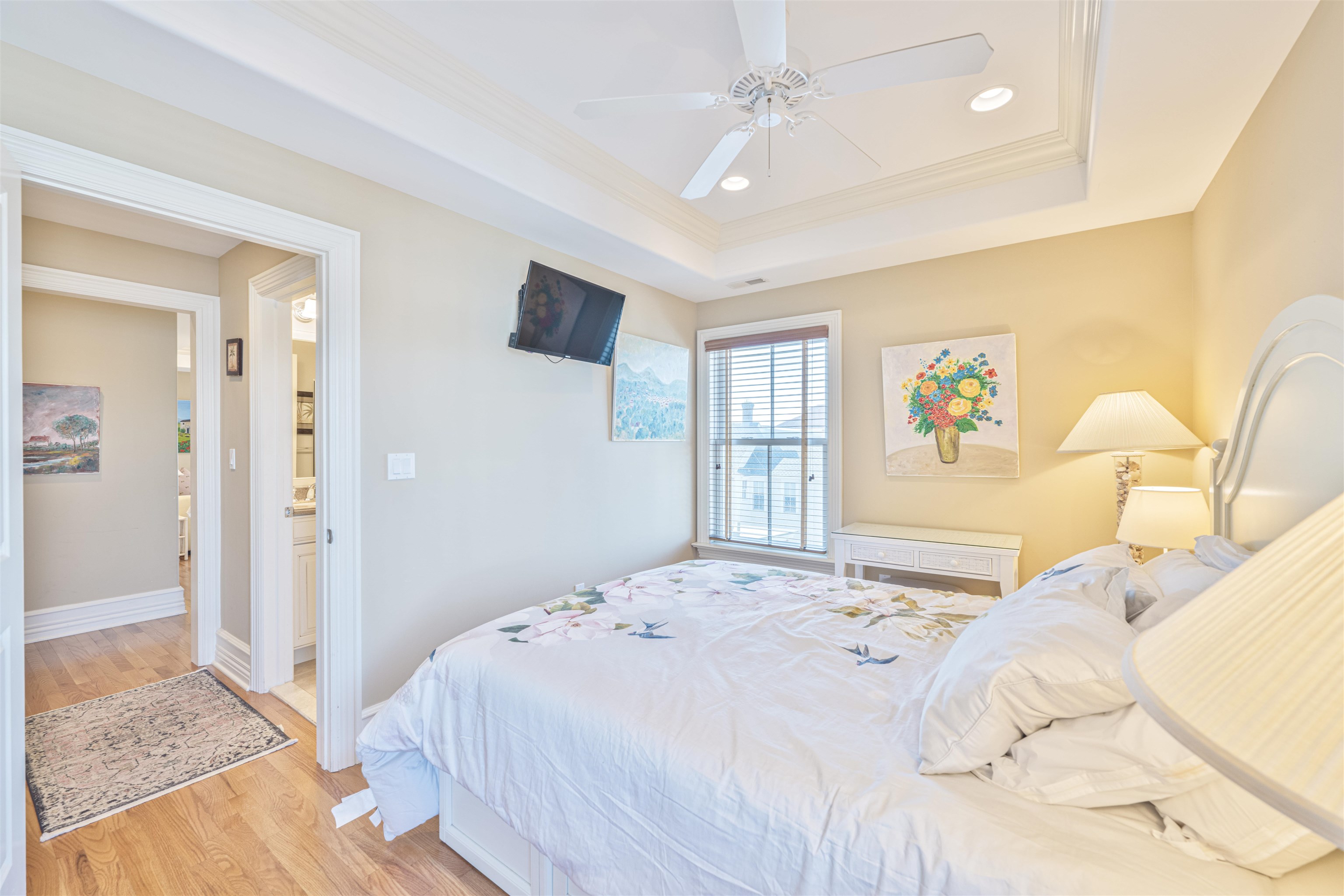 927 Beach, Unit 6 Cape May, NJ 08204 - Photo 23 of 34 a bedroom with a bed dresser and a window