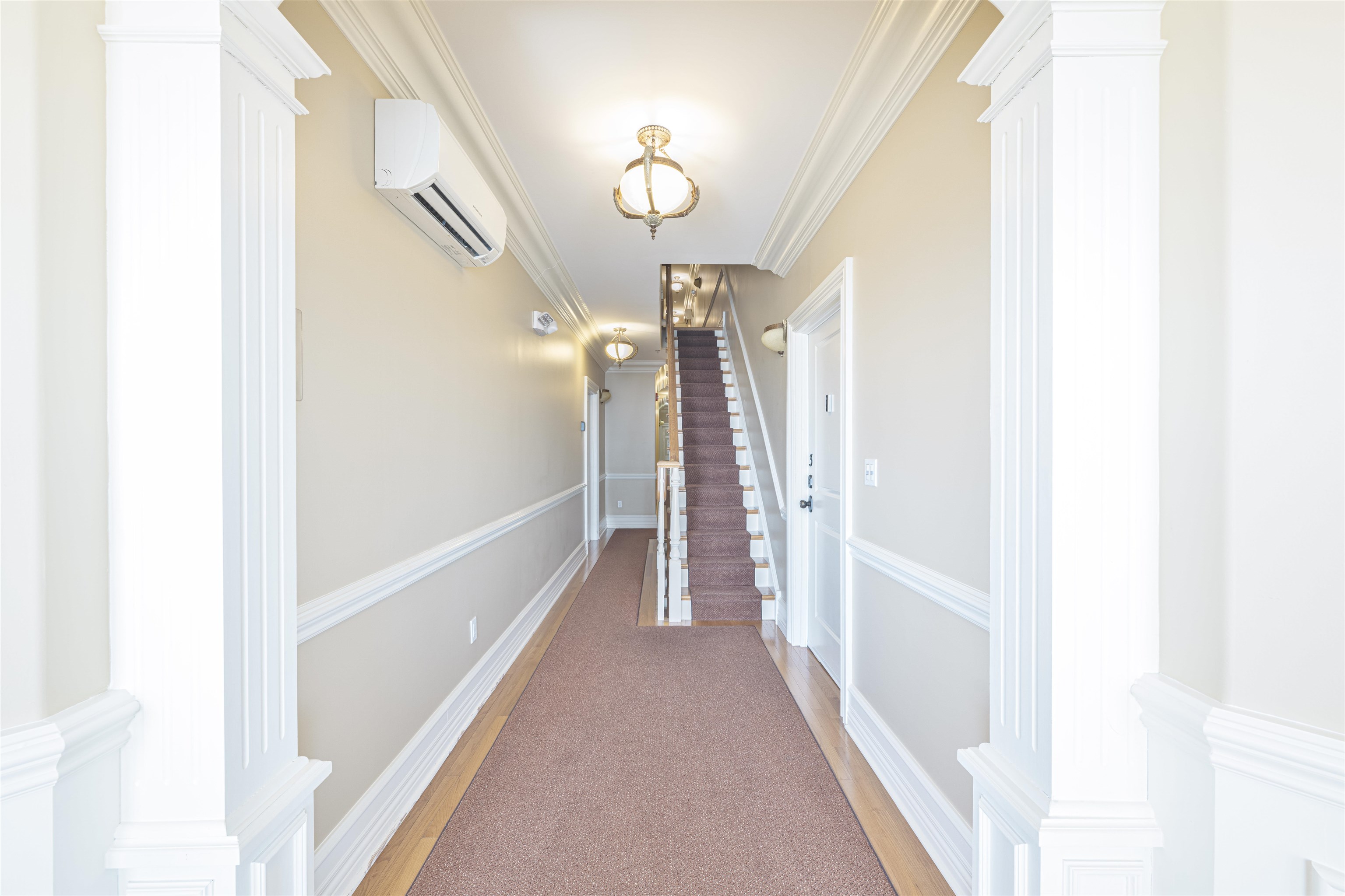 927 Beach, Unit 6 Cape May, NJ 08204 - Photo 28 of 34 a view of a hallway with chandelier