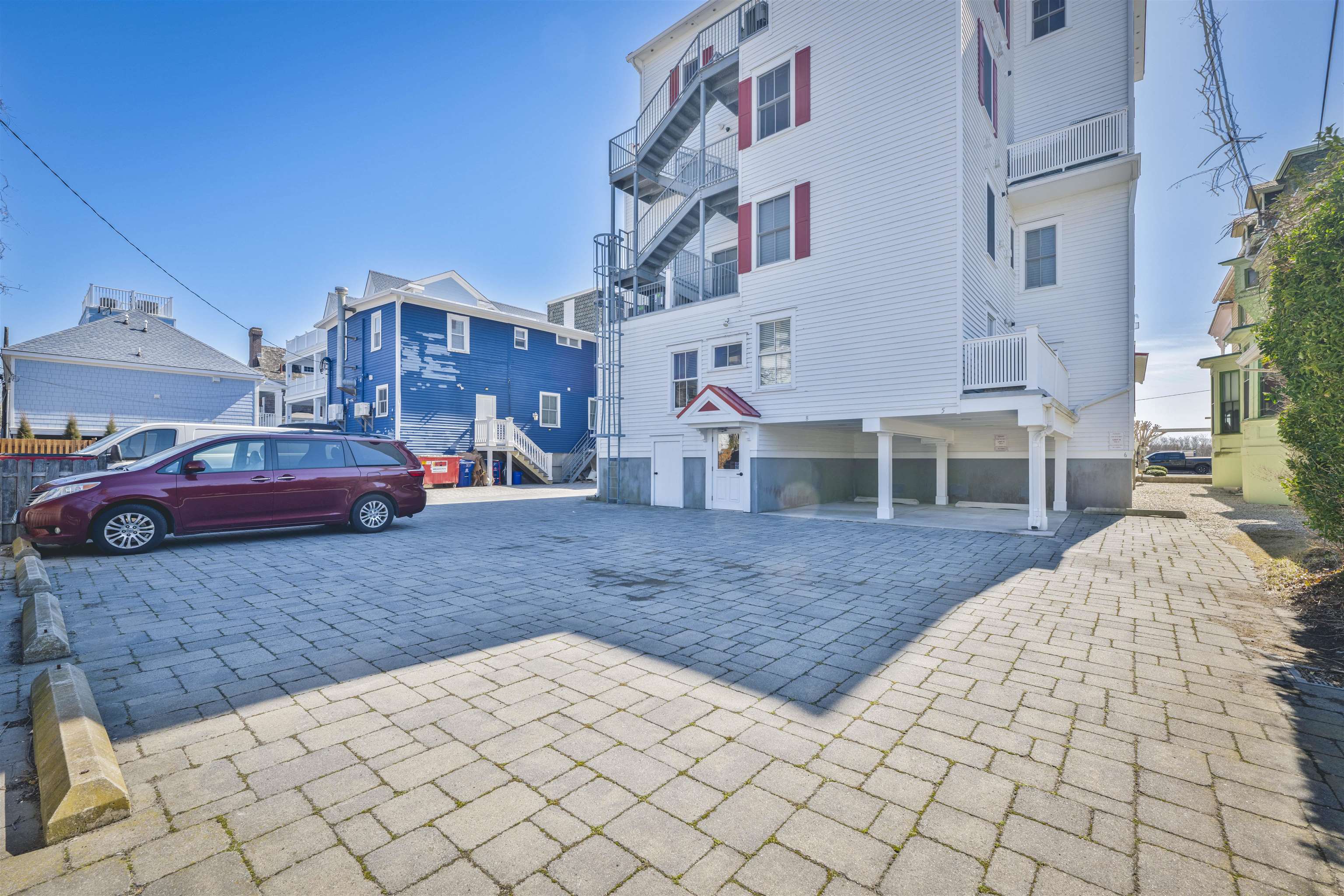 927 Beach, Unit 6 Cape May, NJ 08204 - Photo 33 of 34 a view of a backyard with table and chairs