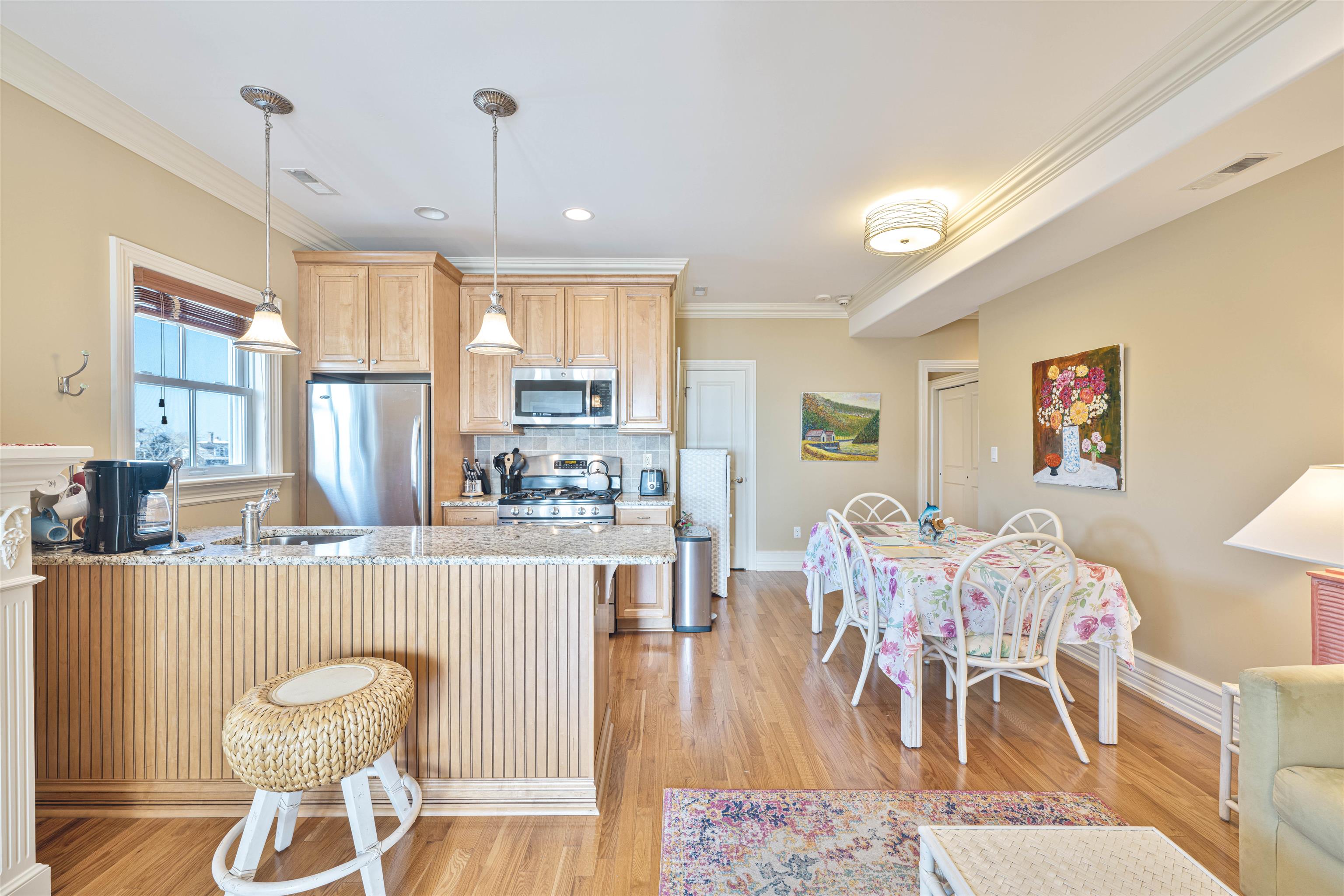 927 Beach, Unit 6 Cape May, NJ 08204 - Photo 8 of 34 a living room with furniture and a large window