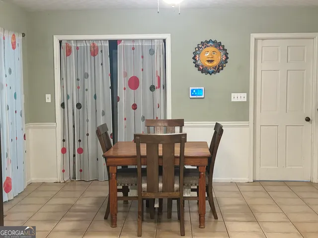 a view of a living room and dining room