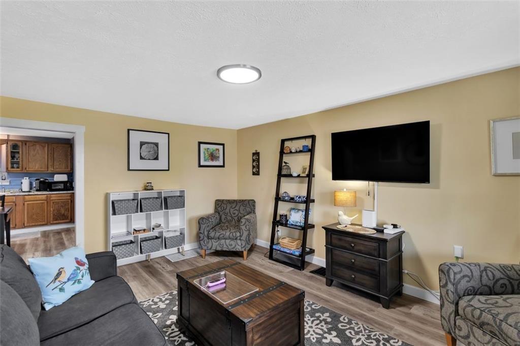 1646 Main Street Leechburg, PA 15656 - Photo 12 of 33 a living room with furniture and a flat screen tv