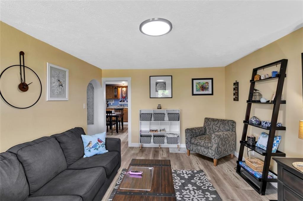 1646 Main Street Leechburg, PA 15656 - Photo 13 of 33 a living room with furniture a rug and a window