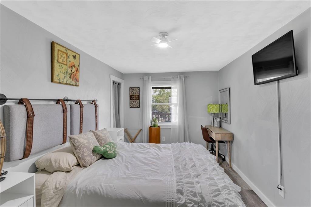 1646 Main Street Leechburg, PA 15656 - Photo 19 of 33 a bedroom with a bed tv and a window