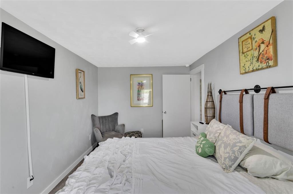 1646 Main Street Leechburg, PA 15656 - Photo 22 of 33 a bedroom with a bed and a flat screen tv