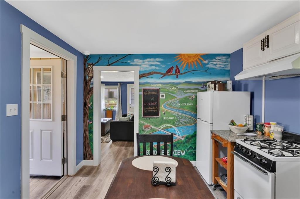 1646 Main Street Leechburg, PA 15656 - Photo 26 of 33 a kitchen with stainless steel appliances granite countertop a stove and a refrigerator