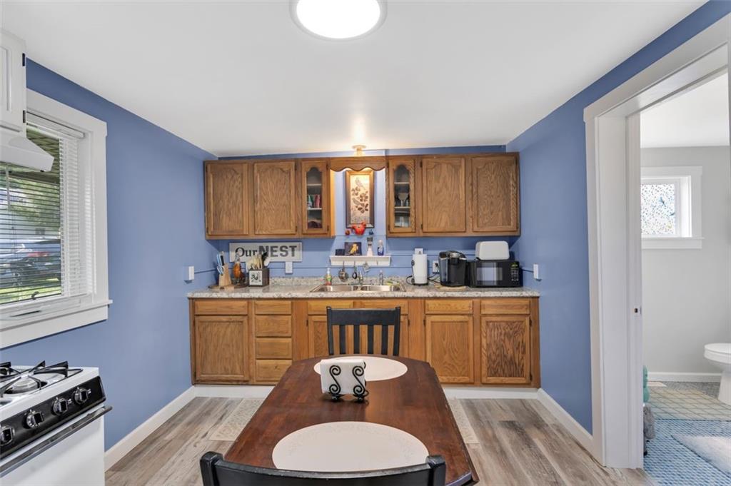 1646 Main Street Leechburg, PA 15656 - Photo 28 of 33 a kitchen with a sink stove and wooden floor