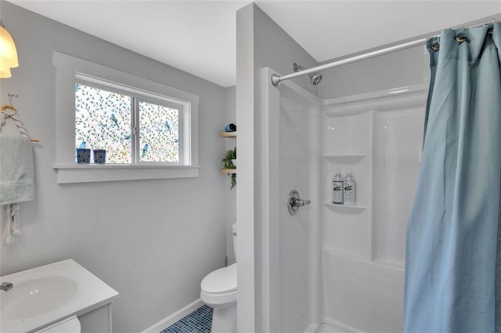 1646 Main Street Leechburg, PA 15656 - Photo 30 of 33 a bathroom with a shower toilet and sink