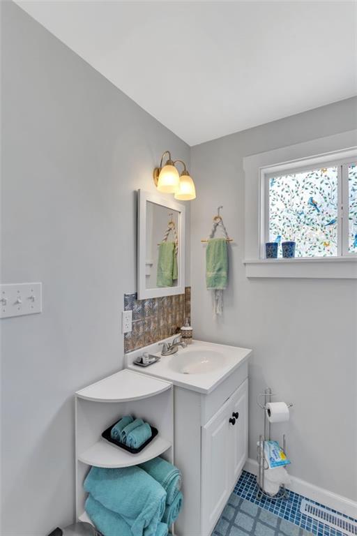 1646 Main Street Leechburg, PA 15656 - Photo 31 of 33 a bathroom with a sink and a mirror