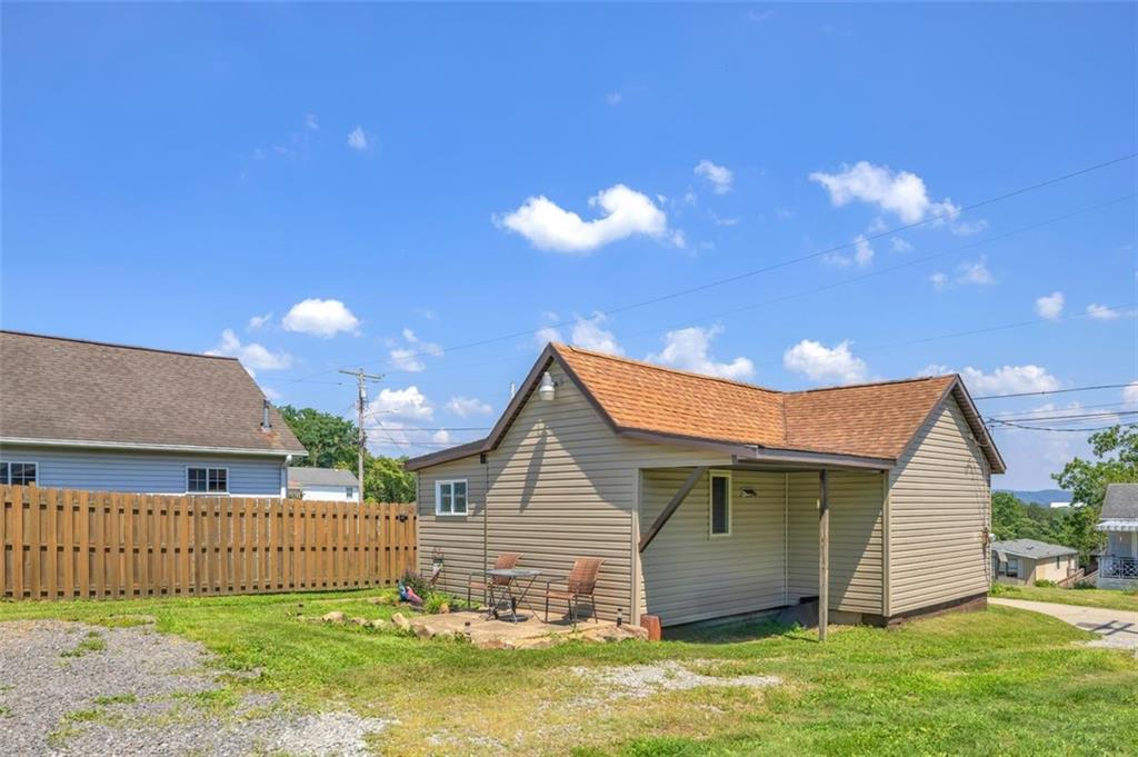 1646 Main Street Leechburg, PA 15656 - Photo 4 of 33 a backyard of a house with table and chairs