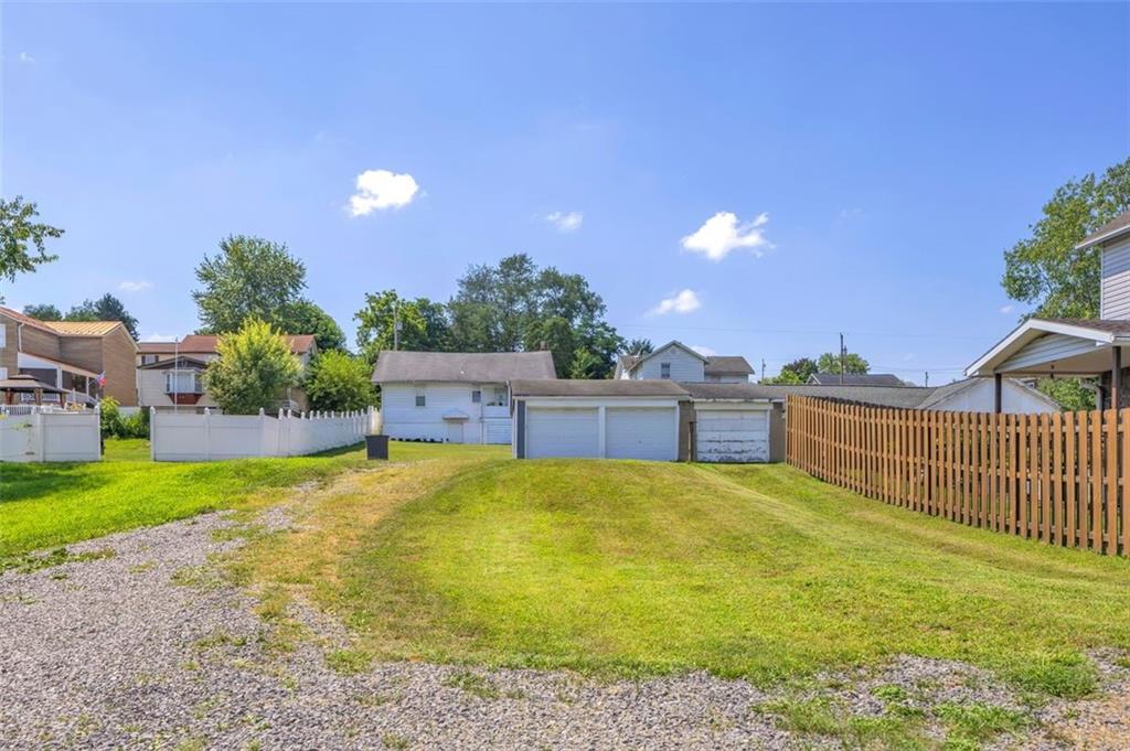 1646 Main Street Leechburg, PA 15656 - Photo 5 of 33 a view of a house with a yard and basketball court