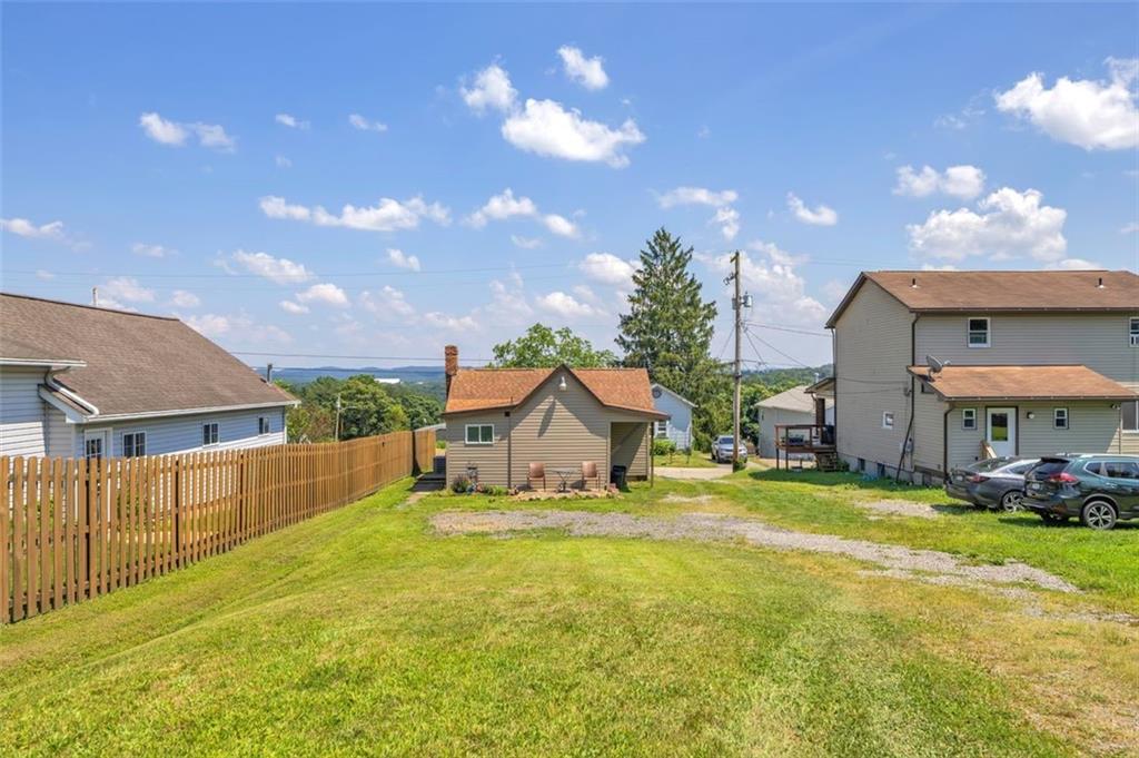 1646 Main Street Leechburg, PA 15656 - Photo 7 of 33 a view of a house with a yard and sitting area