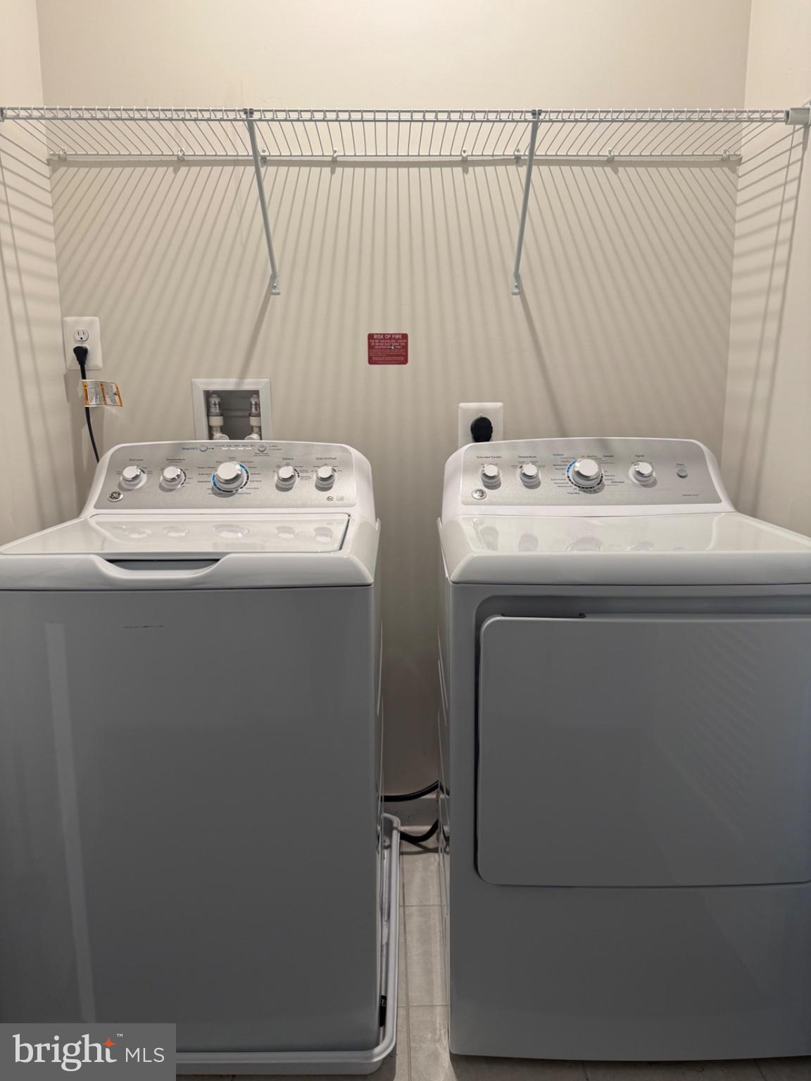 10010 Ruffian Way, Unit R Laurel, MD 20723 - Photo 5 of 30 Modern laundry setup in bright space.