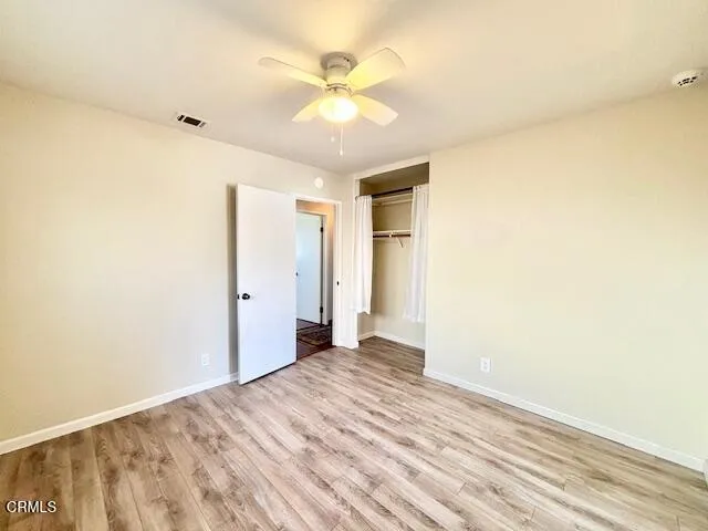 a view of a livingroom with a chandelier fan