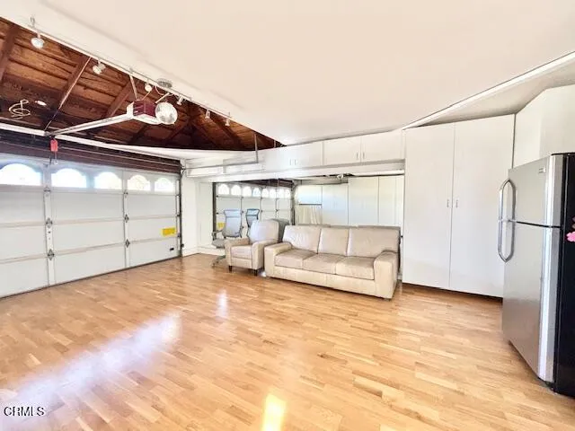 a view of a room with wooden floor