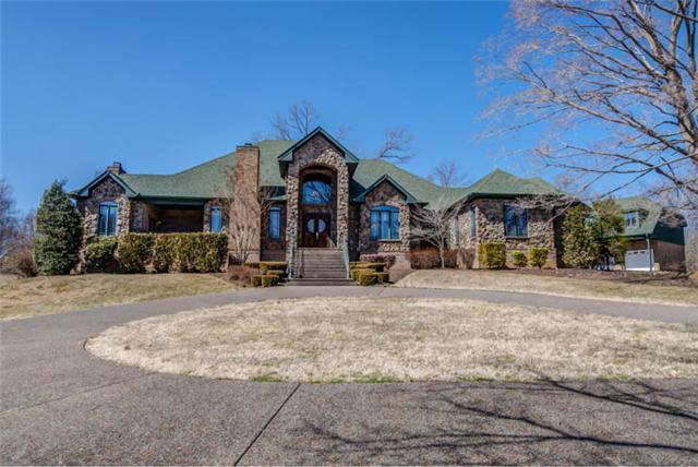 Beautiful all brick and stone custom built home on 29 acres, gated entrance, old tobacco barn, beautiful views!