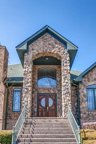 Two story stone entrance welcomes you home!