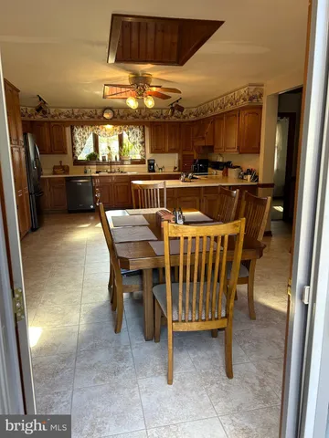 a dining room with furniture and window