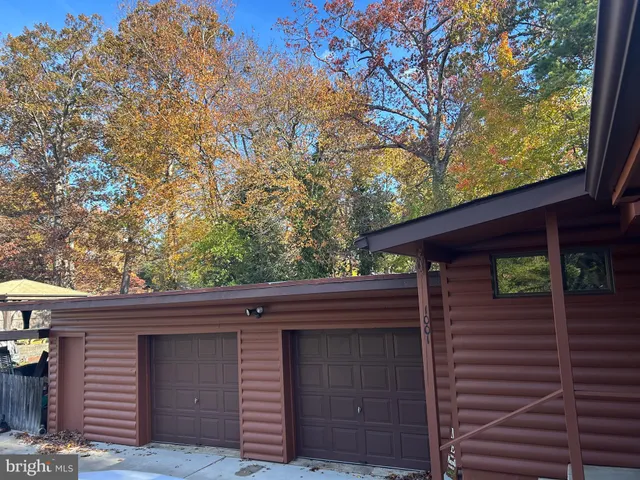 a view of a house with a tree