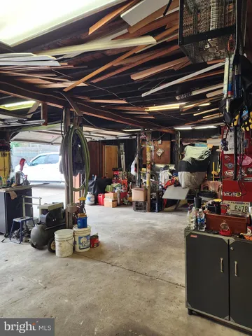 a view of a garage with lots of stuff