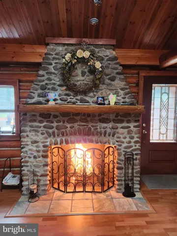 a view of a fireplace with wooden floor