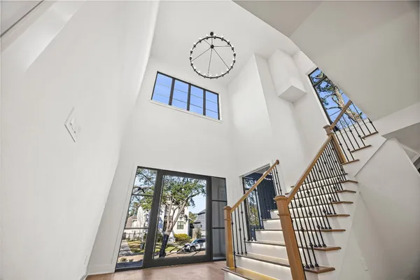 a view of a house with wooden fence