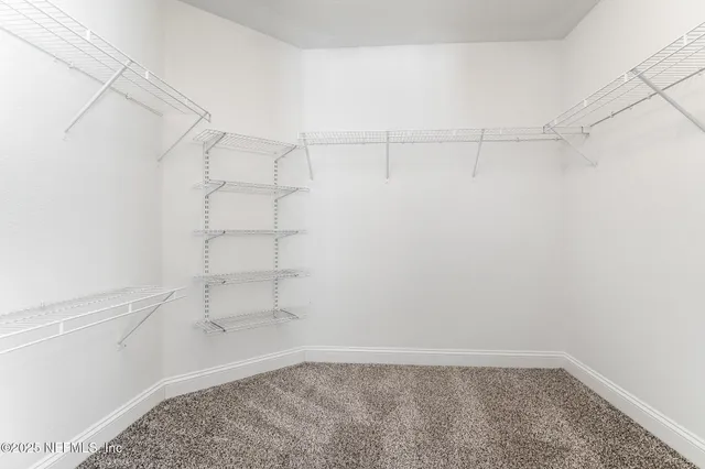 a view of a room with racks on the wall