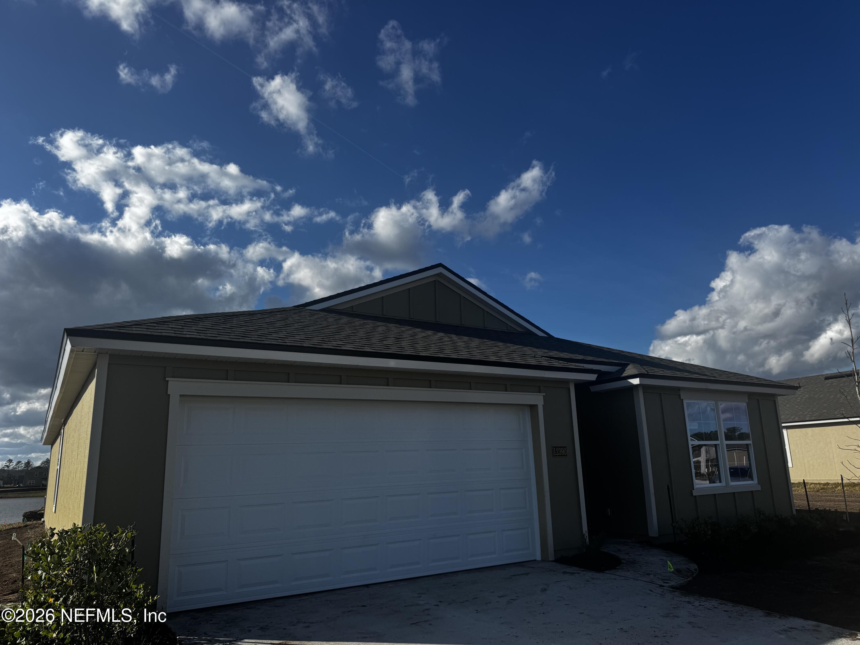 12390 Russian Olive Road Jacksonville, FL 32218 - Photo 2 of 67 a black building with trees in the background