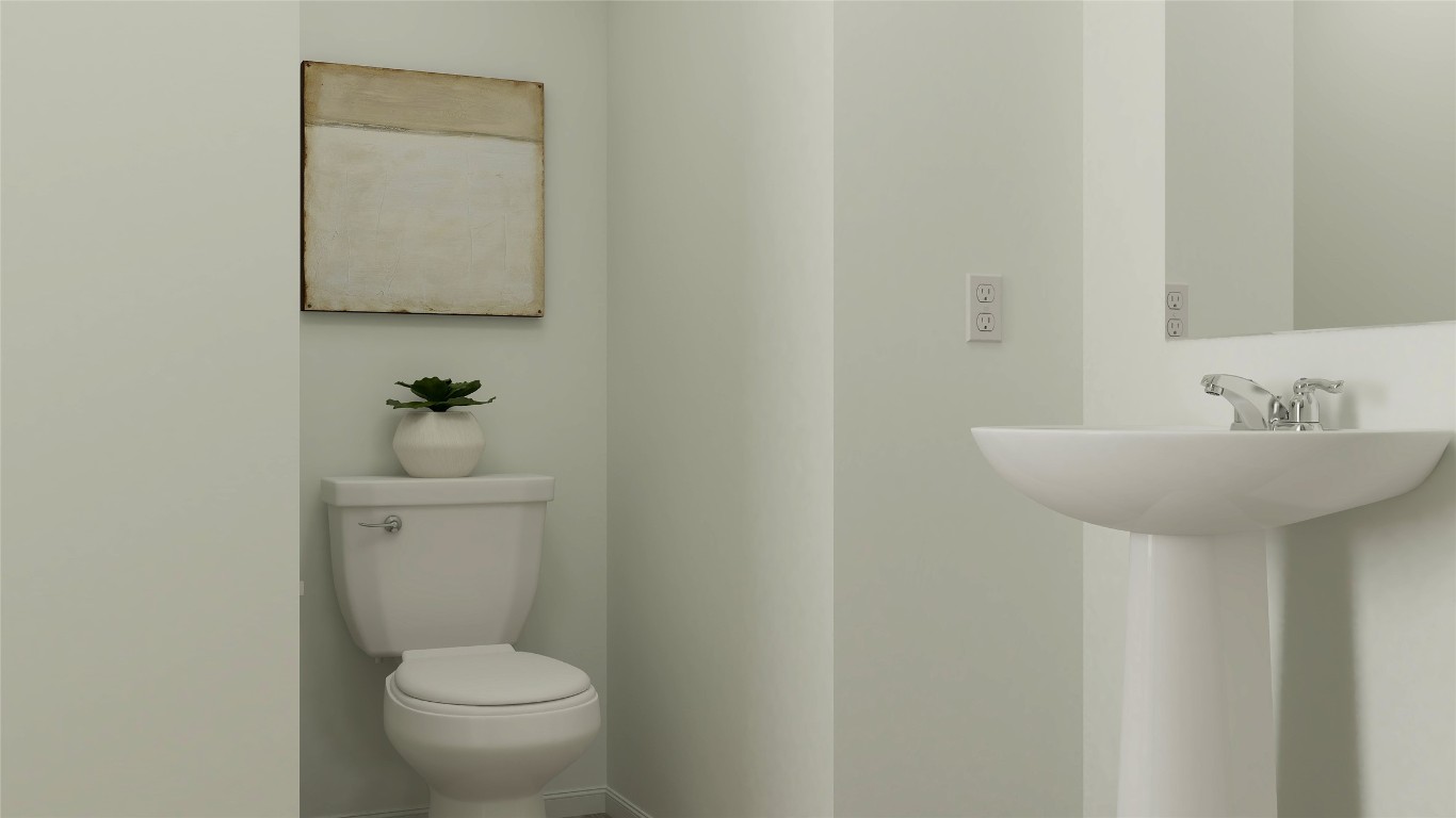 950 Pertuso Lane Huffman, TX 77336 - Photo 17 of 18 a bathroom with a toilet sink and mirror