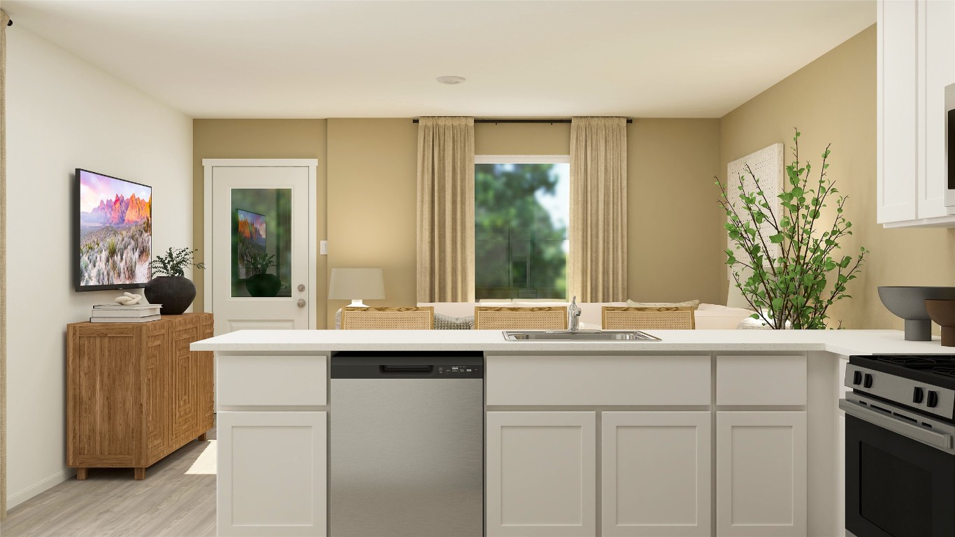 950 Pertuso Lane Huffman, TX 77336 - Photo 7 of 18 a kitchen with a sink and a window