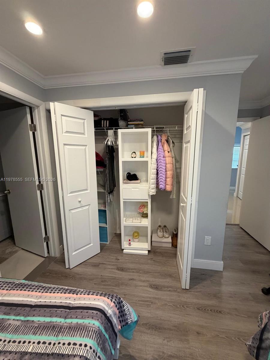 10285 Allegro Drive Boca Raton, FL 33428 - Photo 29 of 55 a view of a hallway with wooden floor and windows