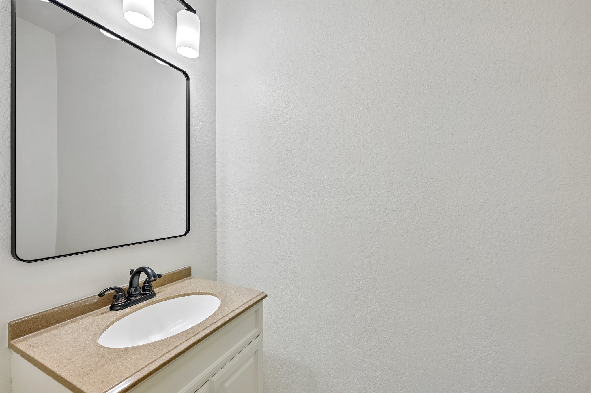 4100 Mocha Trail Austin, TX 78728 - Photo 23 of 33 A well-appointed powder room features a sleek vanity and a contemporary mirror.