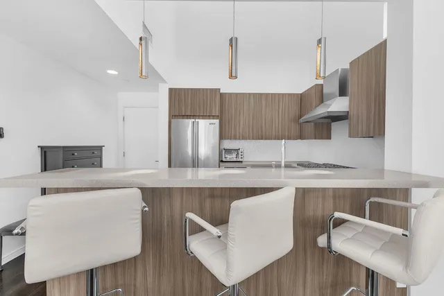 a kitchen with a stove sink and refrigerator