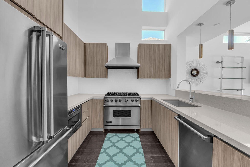 350 Goleta Way Palm Springs, CA 92264 - Photo 16 of 60 a kitchen with a stove sink and refrigerator