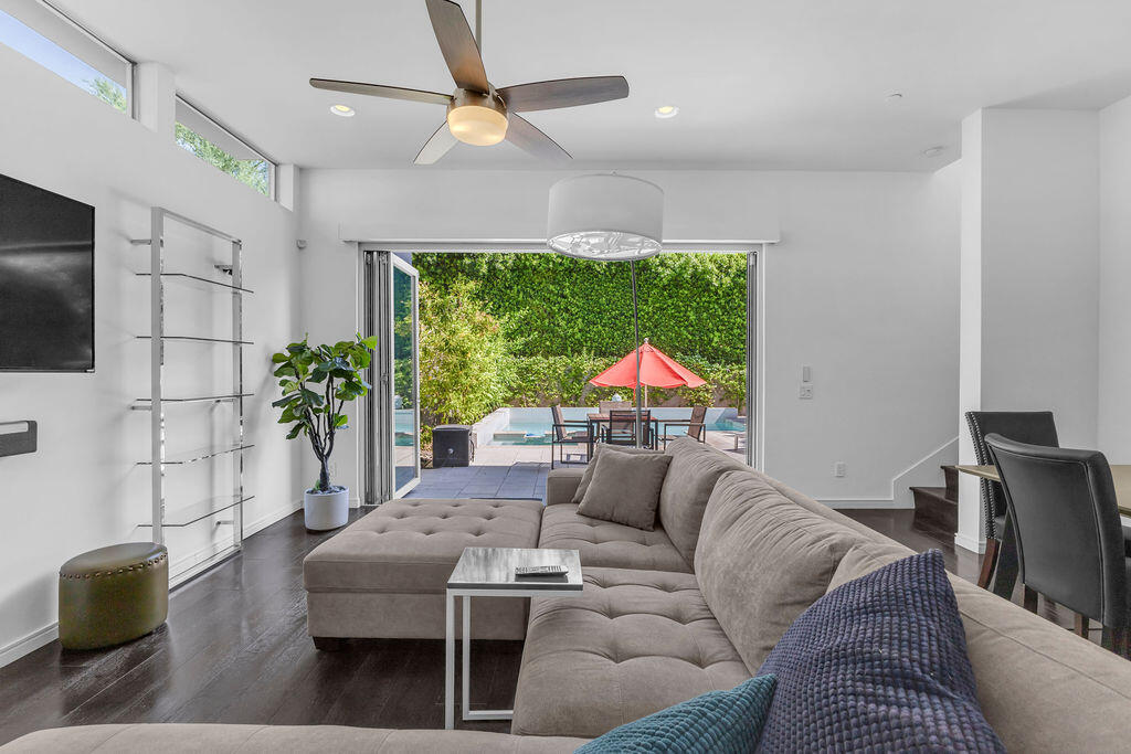 350 Goleta Way Palm Springs, CA 92264 - Photo 23 of 60 a living room with furniture a flat screen tv and a large window