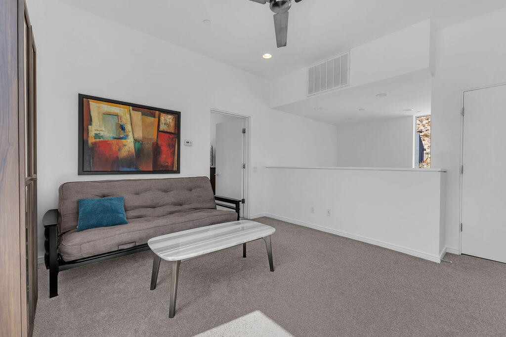 350 Goleta Way Palm Springs, CA 92264 - Photo 26 of 60 a living room with furniture and a painting on the wall