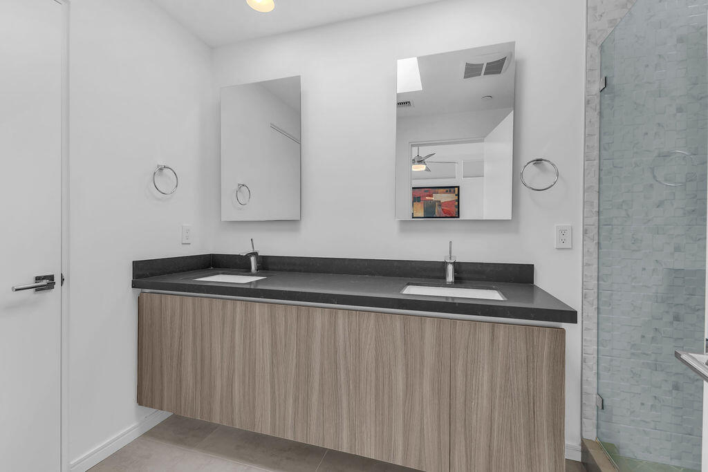 350 Goleta Way Palm Springs, CA 92264 - Photo 31 of 60 a bathroom with a granite countertop sink and a mirror
