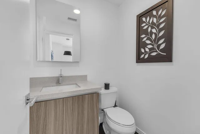 a bedroom with a bed and a lamp