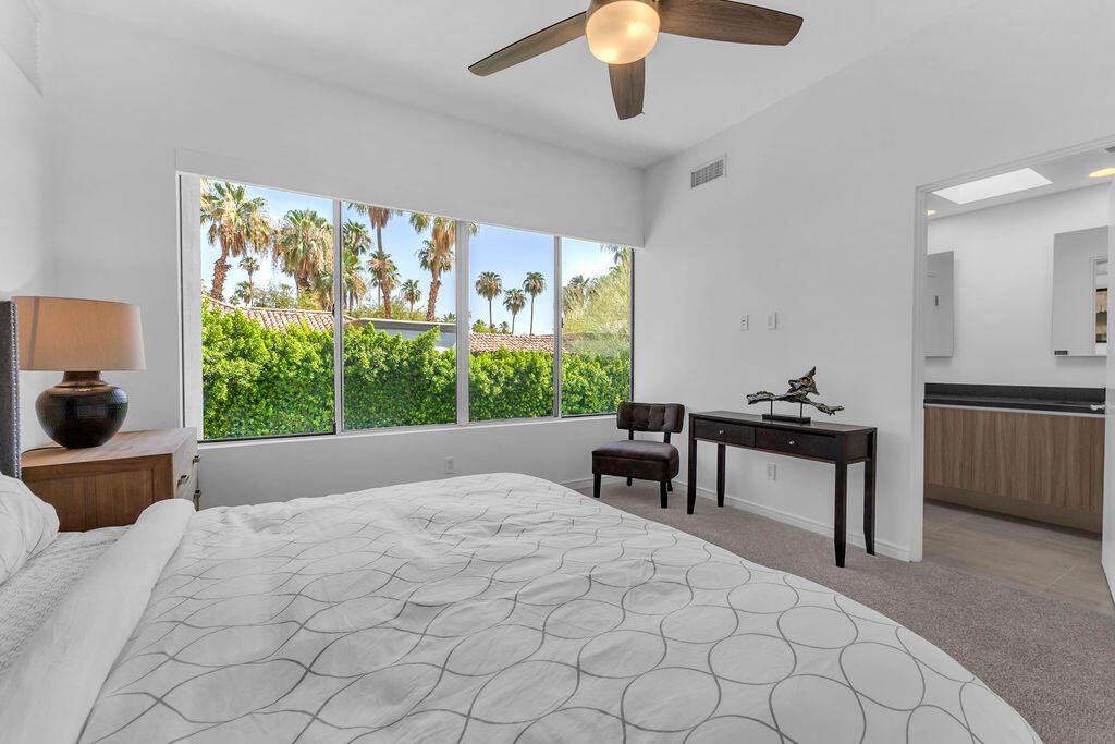 350 Goleta Way Palm Springs, CA 92264 - Photo 34 of 60 a bed sitting in a room next to a window