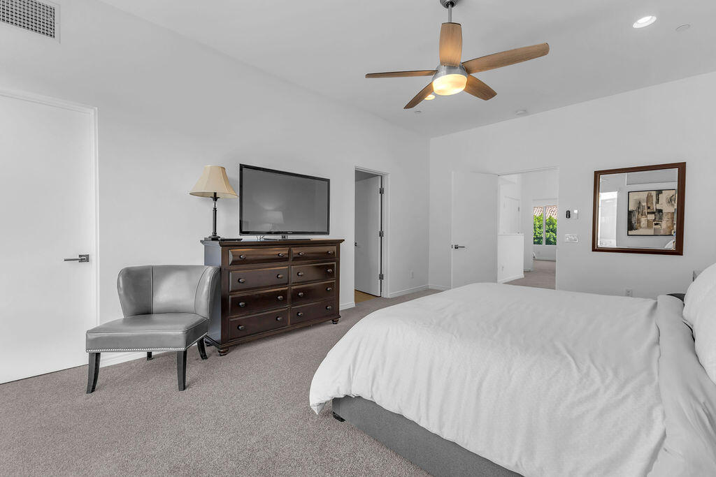 350 Goleta Way Palm Springs, CA 92264 - Photo 37 of 60 a bedroom with a bed and a television