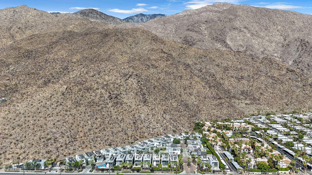 350 Goleta Way Palm Springs, CA 92264 - Photo 57 of 60 a view of a dry yard with mountains in the background