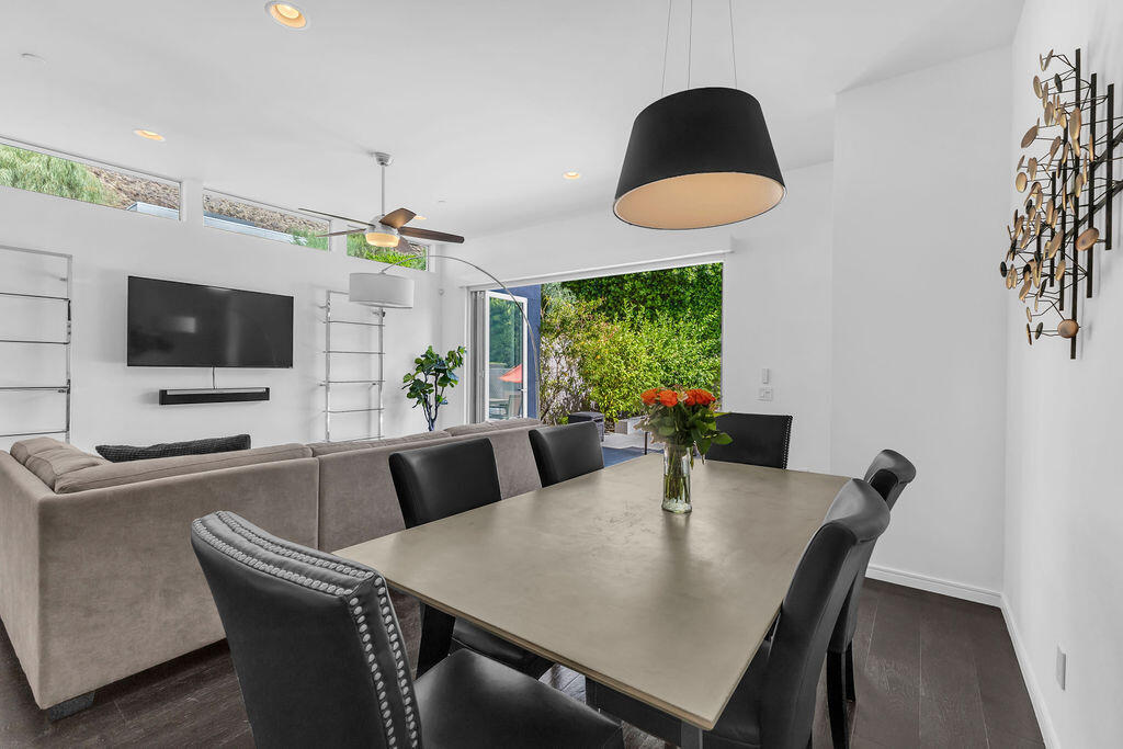 350 Goleta Way Palm Springs, CA 92264 - Photo 6 of 60 a view of a dining room with furniture and wooden floor